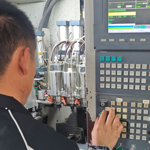 worker is operating CNC machine for eyewear production