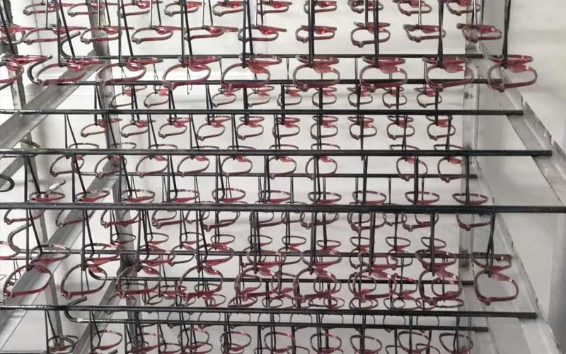 Eyeglasses fronts are hanging on rack